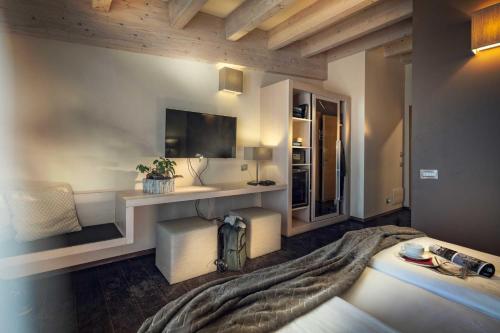 A bed or beds in a room at Brenta Dolomites
