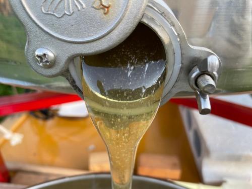 a drink being poured into a machine at Pension KUROSHIOMARU in Setouchi