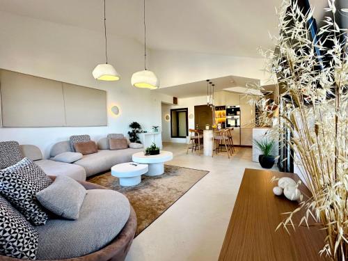 a living room with a couch and a table at Seaside Luxury Apartment - Lozenetz in Lozenets