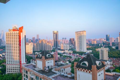 a view of a city with tall buildings at Atour Hotel Shanghai Jing'an Temple West Nanjing Road in Shanghai