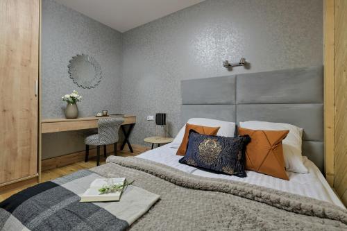 Postel nebo postele na pokoji v ubytování Aparthotel Góralski Spa & Restaurant