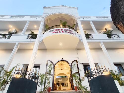 a building with a sign that reads our hotel planet hollywood at Hare Rama Hare Krishna - EESHA Hotel in Rāmeswaram