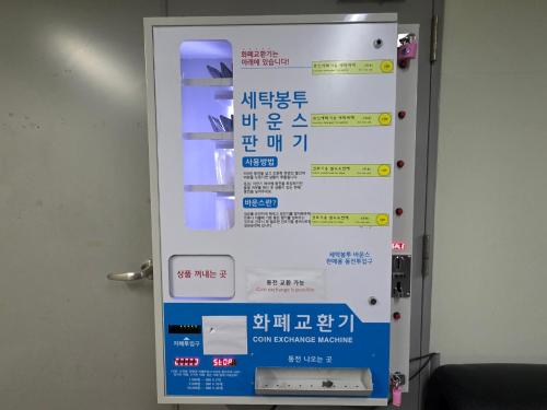 a sign in an elevator with a sign in asian writing at W Residence Hotel Centum City in Busan