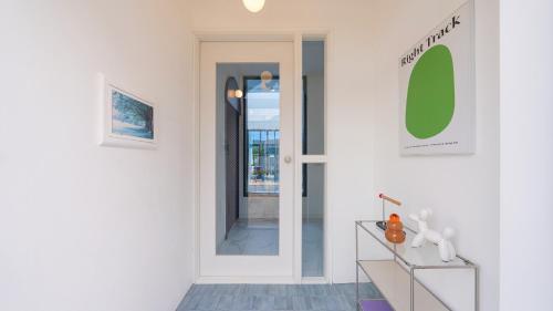 a hallway with a door leading into a room at Le Pavilion Pool Villa in Pohang