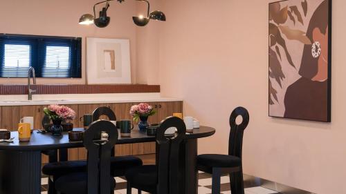a dining room with a table and chairs at Le Pavilion Pool Villa in Pohang