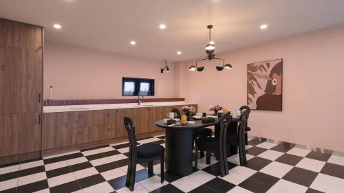 a dining room with a table and chairs at Le Pavilion Pool Villa in Pohang