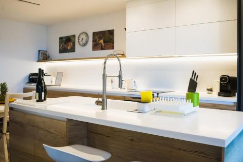 a kitchen with a sink and a counter top at Exclusive Mediterranean Panorama in Sant Pol de Mar in San Pol de Mar