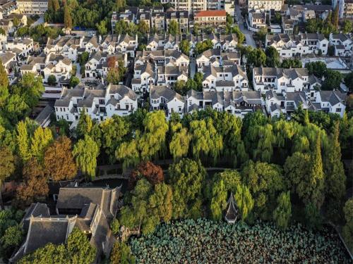 an aerial view of a residential neighborhood with houses at Nanxun Boyang New Century Mingting Resort Hotel in Huzhou