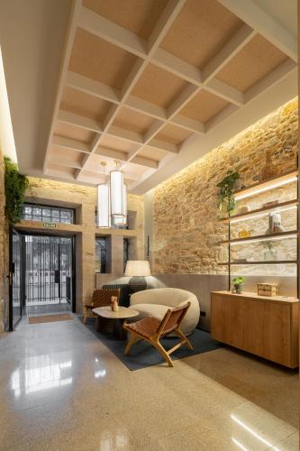 a living room with a couch and a table at Marina 30 in A Coruña