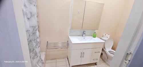 a small bathroom with a sink and a toilet at Diamonds Exclusive Resort in Diamond
