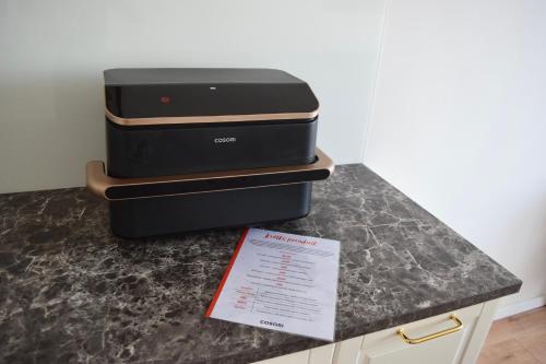 two suitcases sitting on top of a counter at Apartament Teatralny - Komfort w Sercu Miasta Klimatyzacja in Opole