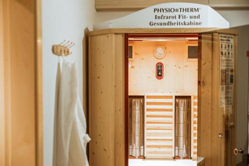 a model of a building with a sign on it at Eschenhof Bed & Breakfast in Kaprun