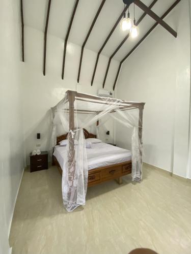 Ένα ή περισσότερα κρεβάτια σε δωμάτιο στο JungleRiverHouse & JungleRiverResort