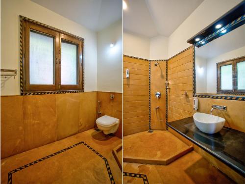 a bathroom with a sink and a toilet at Aveeno Resort & Villas Near Calangute and Baga in Jāmb