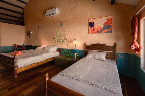 a bedroom with two beds in a room at Hill Village Phu Yen in Phú Hiệp (2)