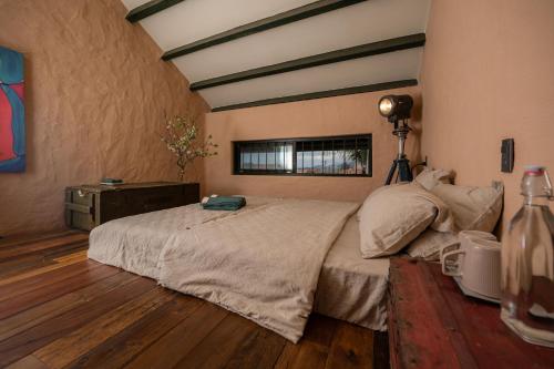 a bedroom with a large bed and a window at Hill Village Phu Yen in Phú Hiệp (2)