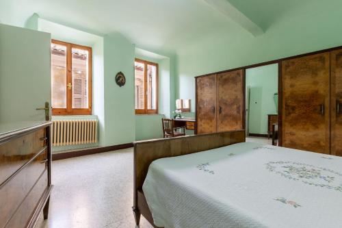 Postel nebo postele na pokoji v ubytování Italian Experience-Falleroni Apartment