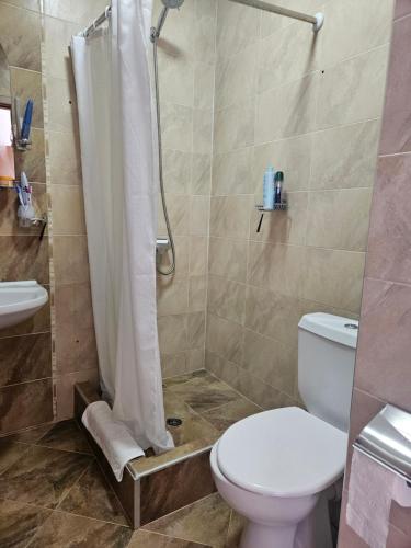 a bathroom with a shower with a toilet and a sink at Elite 4 in Sunny Beach
