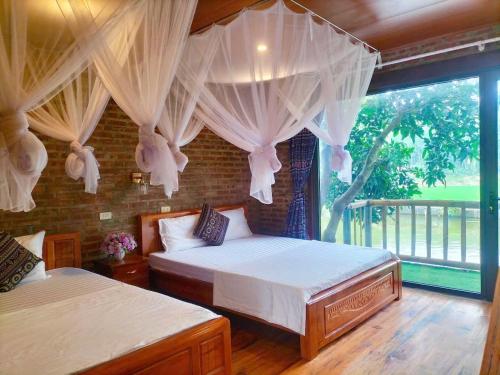 Katil atau katil-katil dalam bilik di Vu Linh Homestay