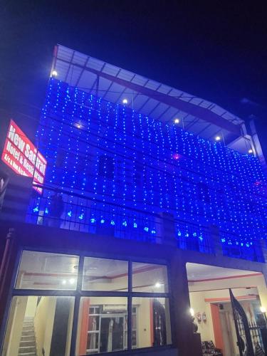 a building with blue lights on top of it at New Samrat Hotel & Restaurant in Srīnagar