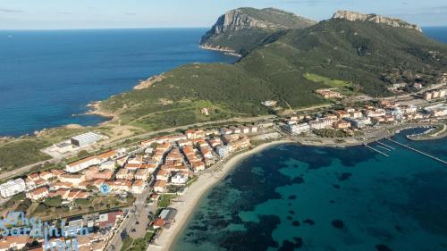 an aerial view of a village on a island at Few steps from the sea in Golfo Aranci