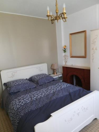 Ένα ή περισσότερα κρεβάτια σε δωμάτιο στο Maison Clair de Lune