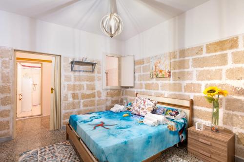 Ένα ή περισσότερα κρεβάτια σε δωμάτιο στο Residenza della Riva Blu