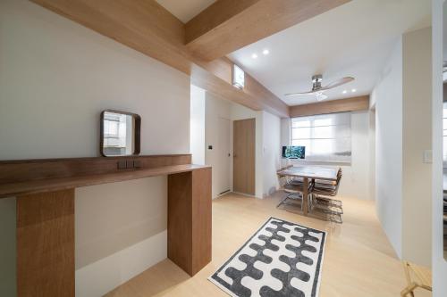 a living room with a table and a television at Trip made in Busan