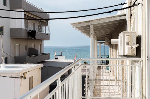 a view of the ocean from the balcony of a building at StelAnna-Apartments in Rethymno Town