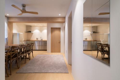 a kitchen and dining room with a table and chairs at Trip made in Busan