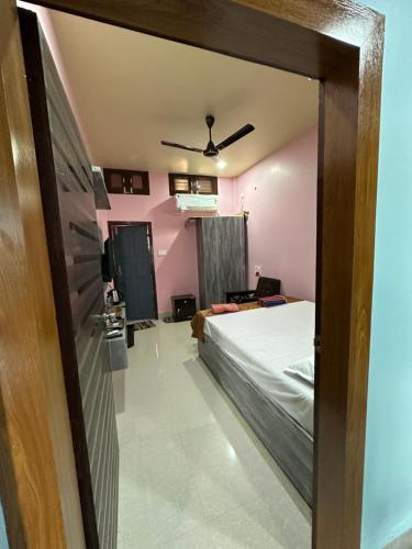 a view of a bedroom with a bed at SK Luxury Homestay in Sivasagar