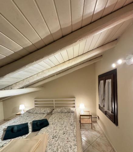 a bedroom with a large bed in a room at Villa Romano in Nicolosi
