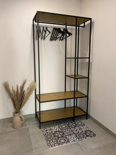 a wine rack with wooden shelves in a room at Gite Le Petit Nid - 3 chambres in Couvin