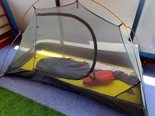 Una cama o camas en una habitación de Mystic Vibes Fitness- Commune