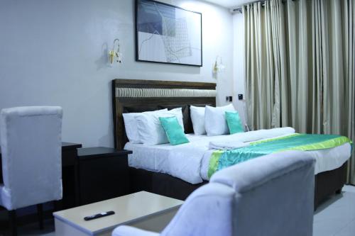 Katil atau katil-katil dalam bilik di Babay tavern and Suites