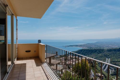a balcony with a view of the ocean at Villa Da Vinci Luxury Panoramic Apartments - Taormina rooms collection in Taormina