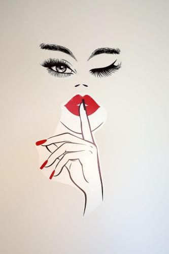 a woman with her finger to her lips at Fasthotel in Cervia