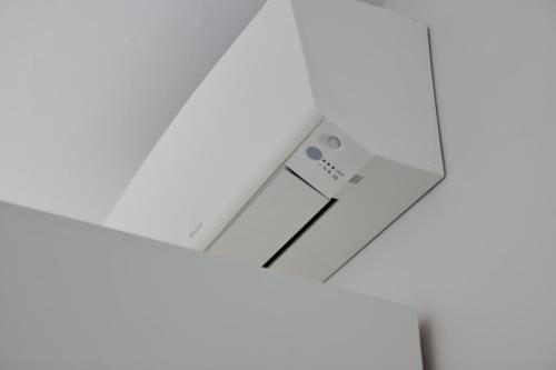 a piece of paper with a remote control on a table at Valeria Apartment in Monza