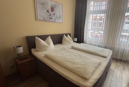 Una cama o camas en una habitación de Hotel Stadt Soest