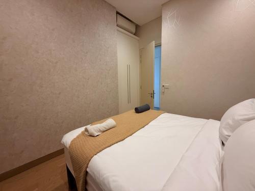 Katil atau katil-katil dalam bilik di Lucentia residence BBCC Lalaport by smart services