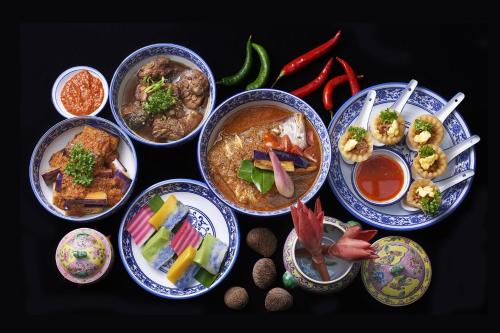 a group of bowls filled with different types of food at Baba House Melaka in Melaka