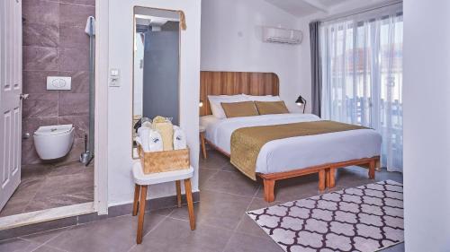 Postel nebo postele na pokoji v ubytování Maya Bistro Hotel & Beach
