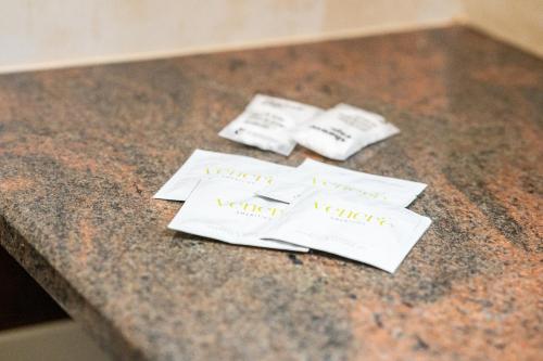 two pieces of paper on a counter withhappy birthday signs at Affittacamere - Il Vicoletto in Porto Torres