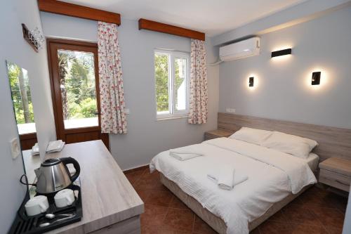 Postel nebo postele na pokoji v ubytování Cirali Hotel