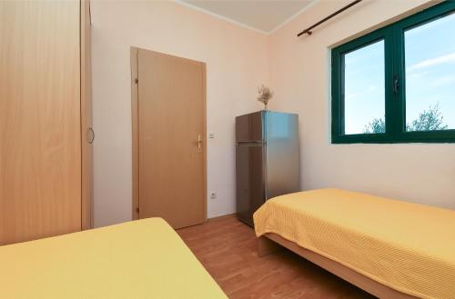 Katil atau katil-katil dalam bilik di Apartments Toni