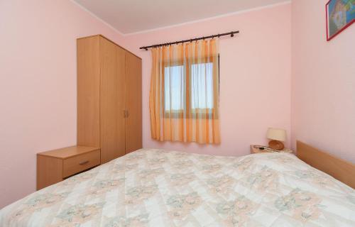 Katil atau katil-katil dalam bilik di Apartments Toni