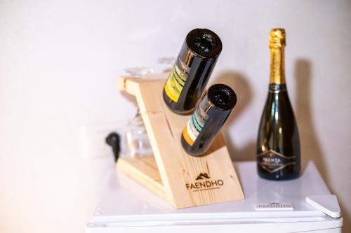 two bottles of champagne sitting on top of a refrigerator at Affittacamere - Il Vicoletto in Porto Torres