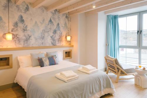 a bedroom with two beds and a window at LacasaDFontibre in Fontibre
