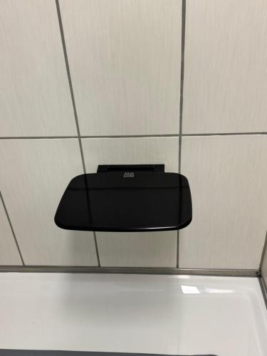 a black object on the ceiling of a room at Ferienwohnung Haus Veronika in Wegscheid