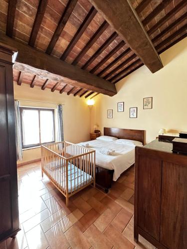 a bedroom with a large bed in a room at Tenuta La Casetta in Casciana Terme